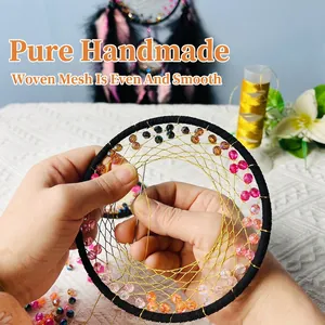 Handmade black dreamcatcher with golden net and colorful beads for wall hanging