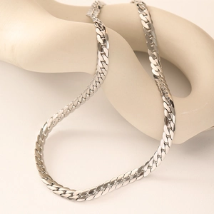 Polished silver stainless steel flat snake chain necklace on an elegant minimalist stand