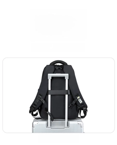 Detail of the luggage trolley strap on the back of a black multifunctional backpack