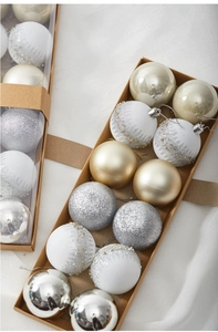 Detail of boxed 6cm Christmas balls with silver and white glitter pine needle patterns