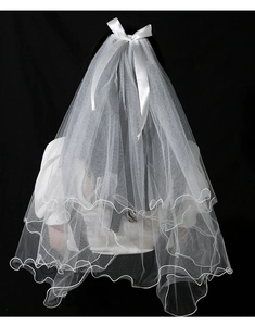 Detail of white double-layer bridal veil with bow and LED lights on black background