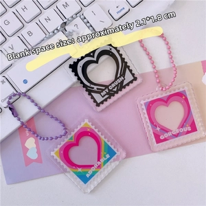 Detail view of heart acrylic photo frames with sizing for DIY pendant charms