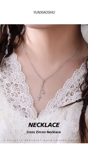 Detail of S925 silver necklace with micro-paved zircon cross and round diamond pendant
