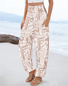 Detailed view of bohemian print trousers with high smocked waist and side pockets