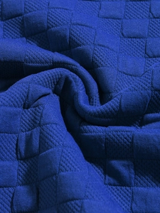 Detail view of the blue knitted fabric with premium checkered texture and soft folds