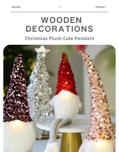 Close-up of LED glowing Christmas gnomes with colorful sequin hats and plush white beards