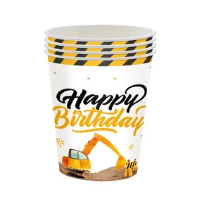 Close-up of disposable paper cups with yellow excavator prints and Happy Birthday text