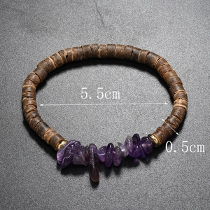 Detail view of bohemian elastic bracelet with natural amethyst stones and coconut beads