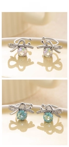 Macro detail of U-shaped bow ear cuff with octagonal zirconia in blue and white