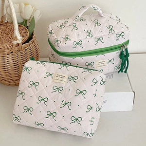 Quilted makeup bag set with green bow print including large case and small pouch