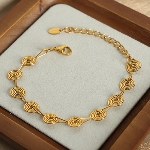 Minimalist gold spiral disc link bracelet in stainless steel with lobster clasp closure