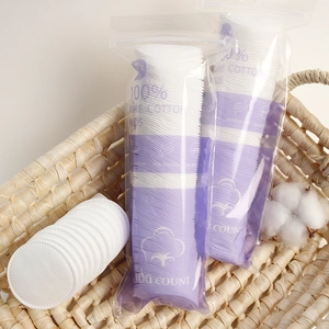 Pack of 100 soft round cotton pads made of pure cotton for makeup removal and skincare