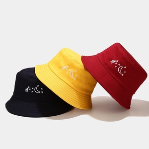Cotton bucket hat with star and moon embroidery in navy, yellow, and red colors