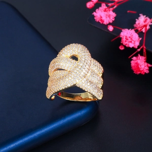 Macro detail of gold braided ring with micro-pave AAA cubic zirconia crystals