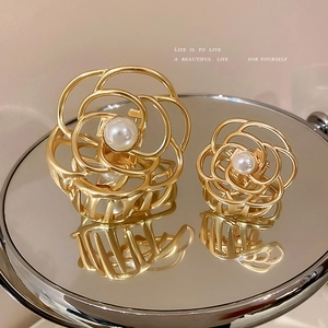 Elegant gold camellia metal hair claw clip with pearl accent in large and small sizes
