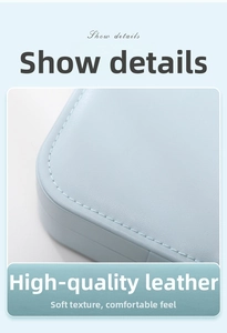 Macro detail of premium light blue leather with soft lychee grain and precise stitching