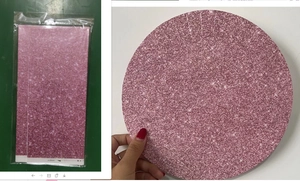 Detail of pink gradient table cover with glittery purple dot patterns for party decor
