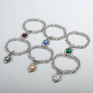 Detail of colorful heart-shaped crystal charms on stainless steel chain bracelets with OT clasp