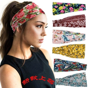 Detail view of elastic yoga headbands with rose, paisley, and floral patterns