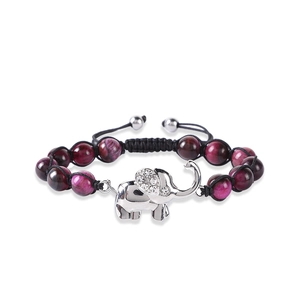 Detail of woven bracelet with purple marble beads and silver elephant charm with rhinestones