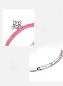 Macro detail of S925 sterling silver stamp and pink enamel ring with square zircon stone
