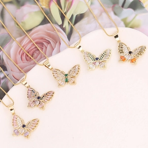 Elegant gold butterfly pendant necklaces with colorful zircon stones on a soft floral background