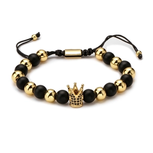 Adjustable natural stone bead bracelet with a golden crown charm on a white background