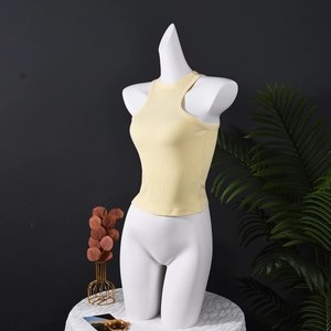 Detail of light yellow ribbed tank top with slim fit racerback on white mannequin