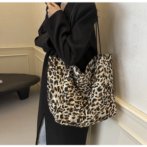 Detail of leopard print quilted tote bag showing texture and spacious shoulder design
