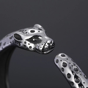 Macro close-up showing the intricate leopard head texture on this silver stainless steel cuff