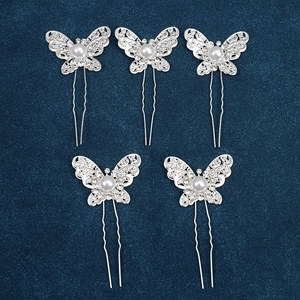 Detail of silver U-shaped hair pins with hollow butterfly designs and white pearls