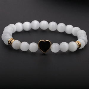 Elegant natural stone bead bracelet with white cat eye gems and golden heart charm