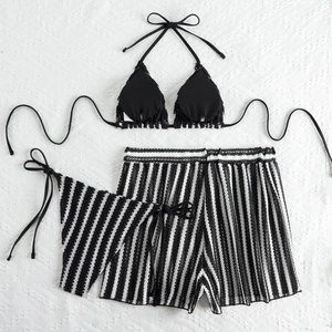 Three-piece black bikini set with vertical striped shorts and delicate lace trim