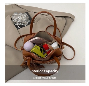 Detail showing internal capacity of the brown woven bag with cosmetics and phone