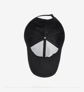 Detail view of the black baseball cap's inner structure and adjustable back strap