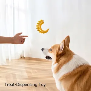 Yellow moon-shaped slow feeder pet toy for dogs with rubber teeth for dental cleaning