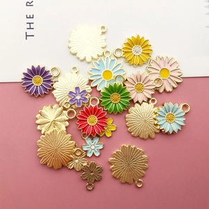 Detail of colorful daisy alloy enamel flower charms for DIY jewelry making and crafts