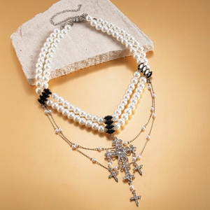 Gothic style layered necklace with faux pearls and sparkling diamond-set silver crosses