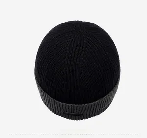 Top down view of a winter knit beanie showing thick ribbed texture and dual color design
