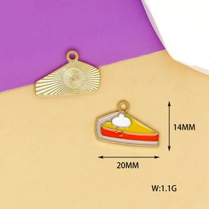 Detail of slice cake enamel pendant with gold trim showing front and back textures