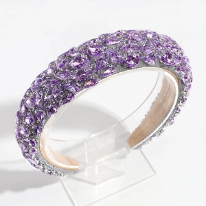 Detail of baroque headband with purple rhinestones and crystal embellishments
