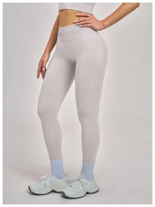 Detailed close-up of high-waist seamless compression yoga leggings in light grey fabric