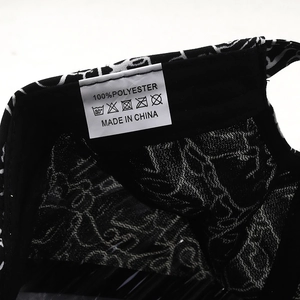 Macro detail of the 100% polyester fabric label and inner stitching on the baseball cap