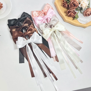 Elegant satin bow hair clip with long streamers in multiple colors for stylish women