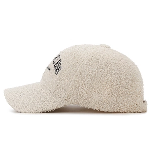 Off-white teddy fleece baseball cap featuring black side letter embroidery and warm texture