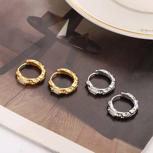 Geometric copper hoop earrings with hammered texture and zircon stones in gold and silver