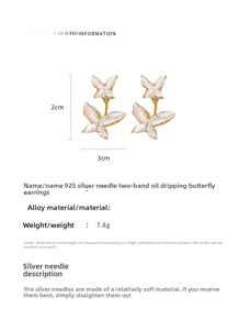 Detailed view of butterfly earrings with 925 silver needles and white enamel oil finish