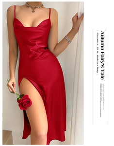 Detail of red satin backless nightgown with side slit and delicate spaghetti straps