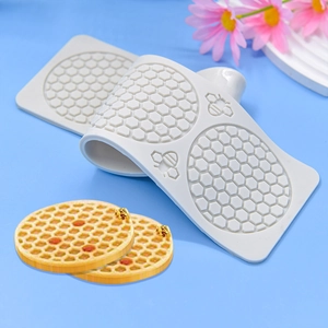 Honeycomb silicone cake mold with bee designs for artistic baking and dessert plating