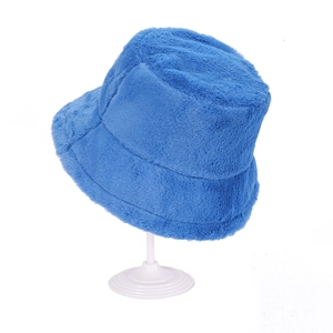 Detailed close-up of fluffy blue faux fur texture on a warm winter bucket hat